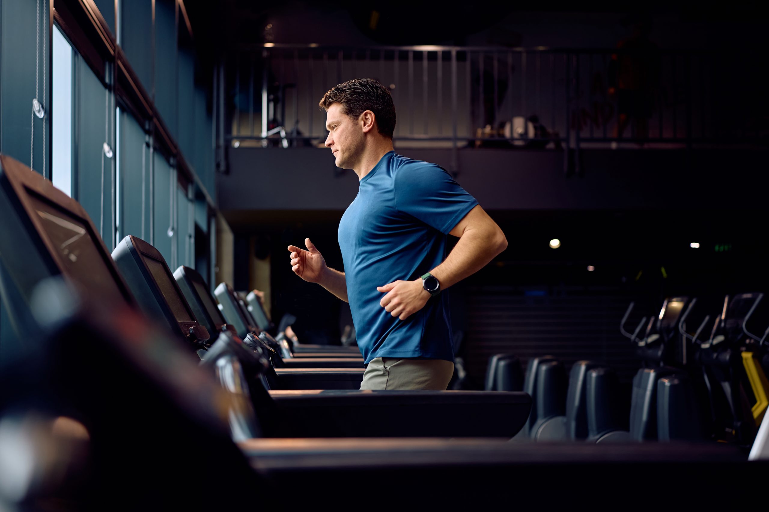 Dedicated,Athlete,Exercising,On,Running,Track,At,Fitness,Center.,Copy Dedicated,Athlete,Exercising,On,Running,Track,At,Fitness,Center.,Copy